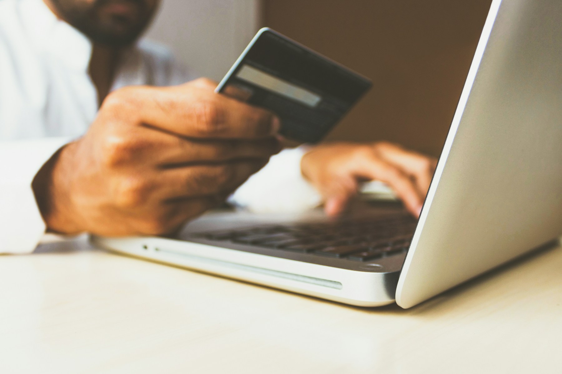 Customer paying by tapping a card on a terminal